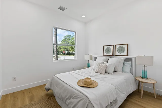 a bedroom with a bed and a window