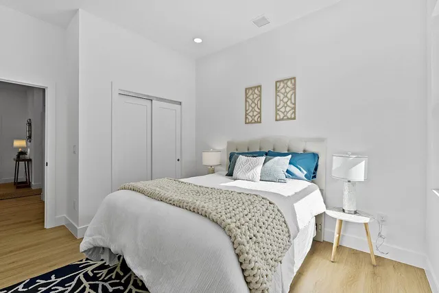 a bedroom with a bed and a table