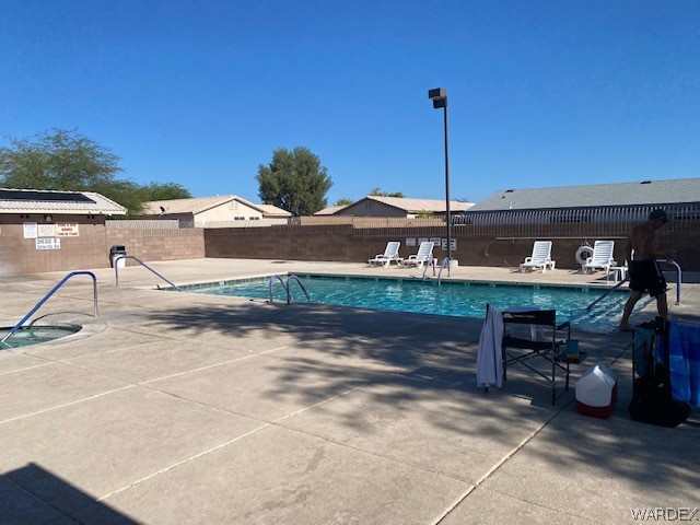 4335 Rafe Avenue Fort Mohave, AZ 86426 - Photo 21 of 22 a view of a chairs and table in the patio