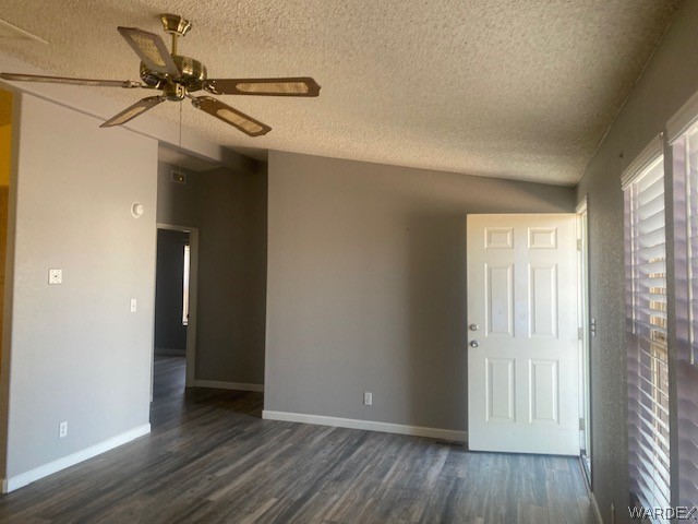 4335 Rafe Avenue Fort Mohave, AZ 86426 - Photo 6 of 22 a view of a livingroom with a hardwood floor and a ceiling fan