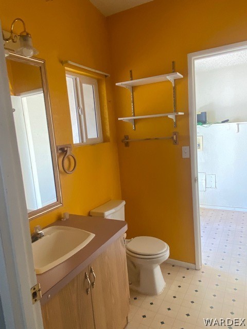 4335 Rafe Avenue Fort Mohave, AZ 86426 - Photo 9 of 22 a bathroom with a granite countertop sink toilet and shower