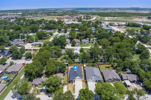 an aerial view of a city with lots of residential buildings