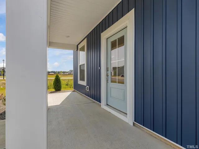 a view of an entryway and livingroom