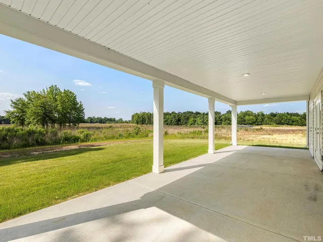a view of a building and front yard