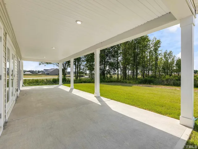 a view of a garden with an outdoor space
