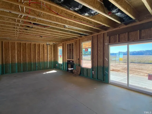 a view of a room with large windows