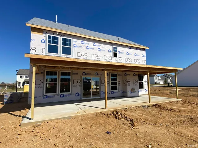 a view of a house with large windows
