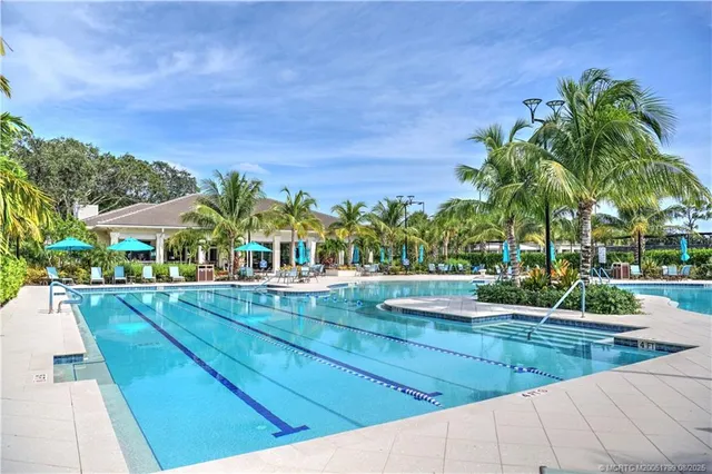 a view of a swimming pool with a patio