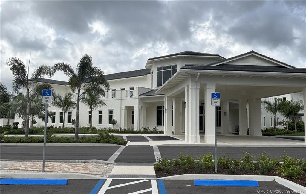 Undisclosed Address Stuart, FL 34997 - Photo 8 of 20 a front view of a house with garden