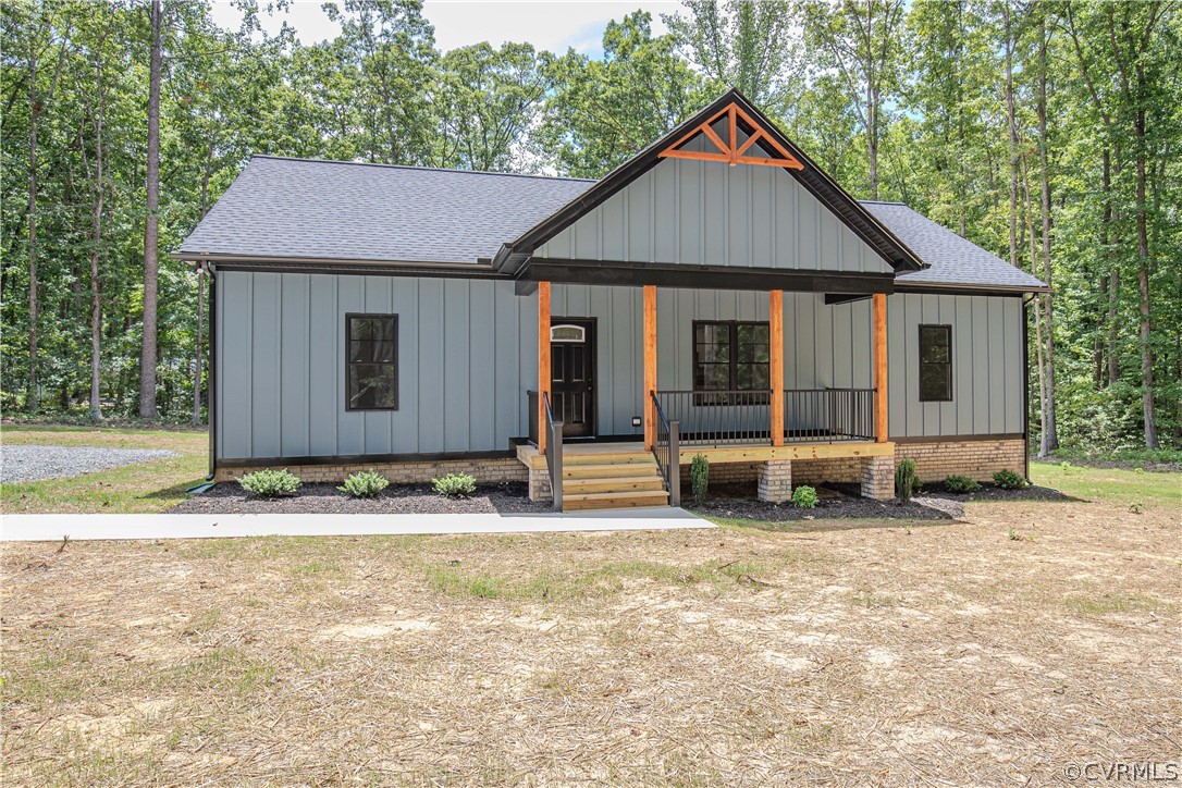 4243 Three Bridge Road Powhatan, VA 23139 - Photo 1 of 32 front view of a house with a yard