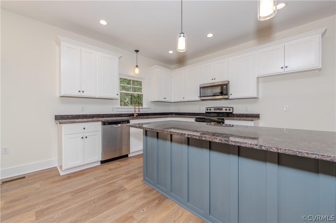 4243 Three Bridge Road Powhatan, VA 23139 - Photo 12 of 32 a kitchen with stainless steel appliances granite countertop a sink dishwasher a stove and a refrigerator with wooden floor