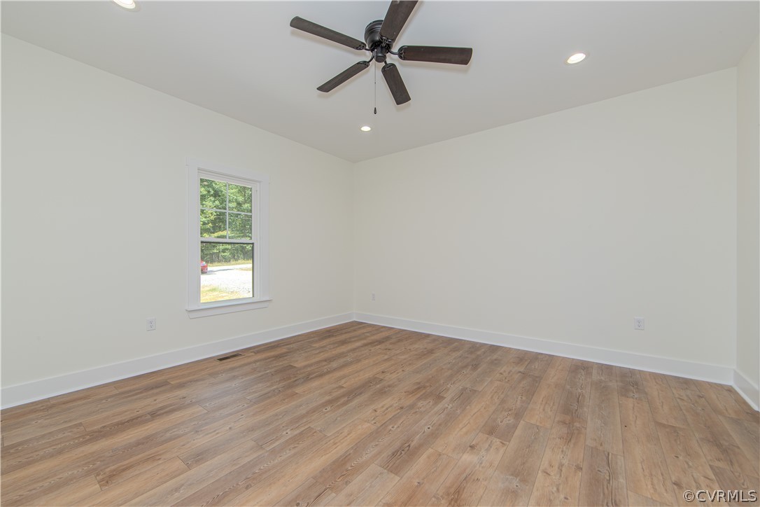 4243 Three Bridge Road Powhatan, VA 23139 - Photo 16 of 32 wooden floor in an empty room with a window