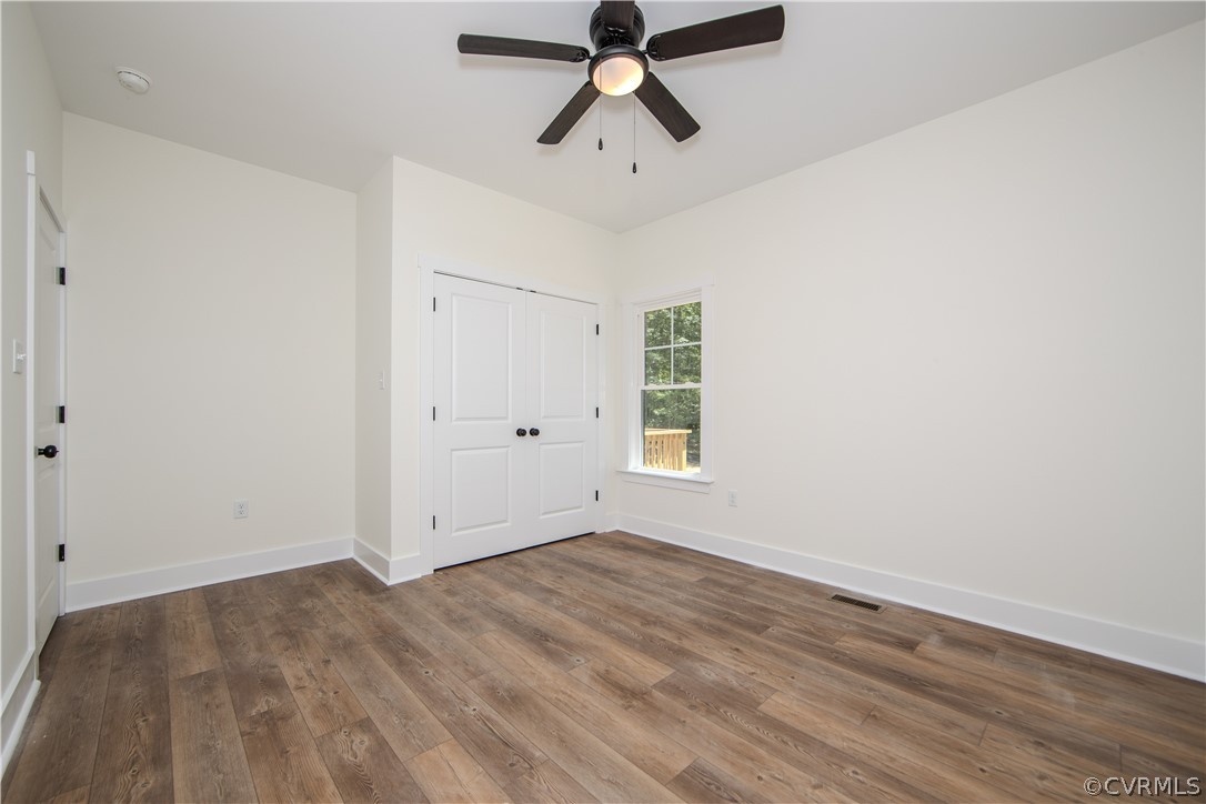 4243 Three Bridge Road Powhatan, VA 23139 - Photo 23 of 32 wooden floor in an empty room