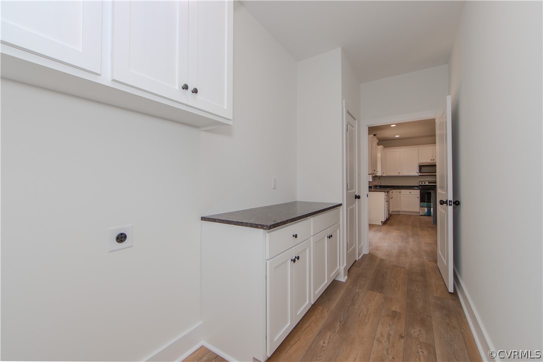 4243 Three Bridge Road Powhatan, VA 23139 - Photo 26 of 32 a kitchen with granite countertop a sink and cabinets