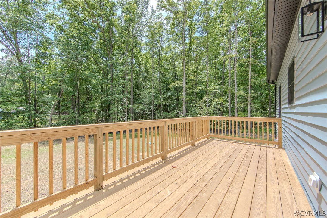 4243 Three Bridge Road Powhatan, VA 23139 - Photo 27 of 32 a balcony with wooden floor and fence