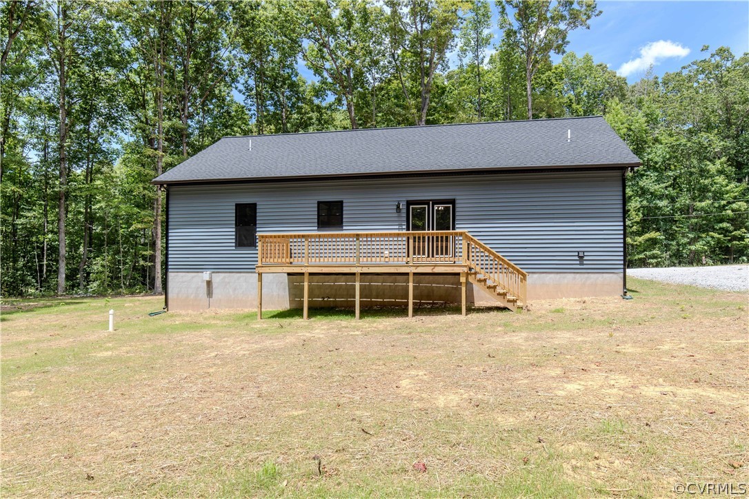 4243 Three Bridge Road Powhatan, VA 23139 - Photo 4 of 32 a house that has a tree in front of it