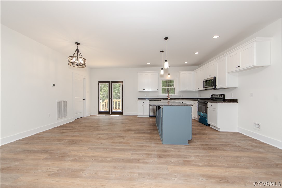 4243 Three Bridge Road Powhatan, VA 23139 - Photo 9 of 32 a kitchen with a sink and cabinets