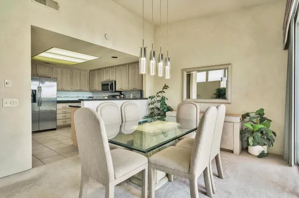 a dining room with furniture and window