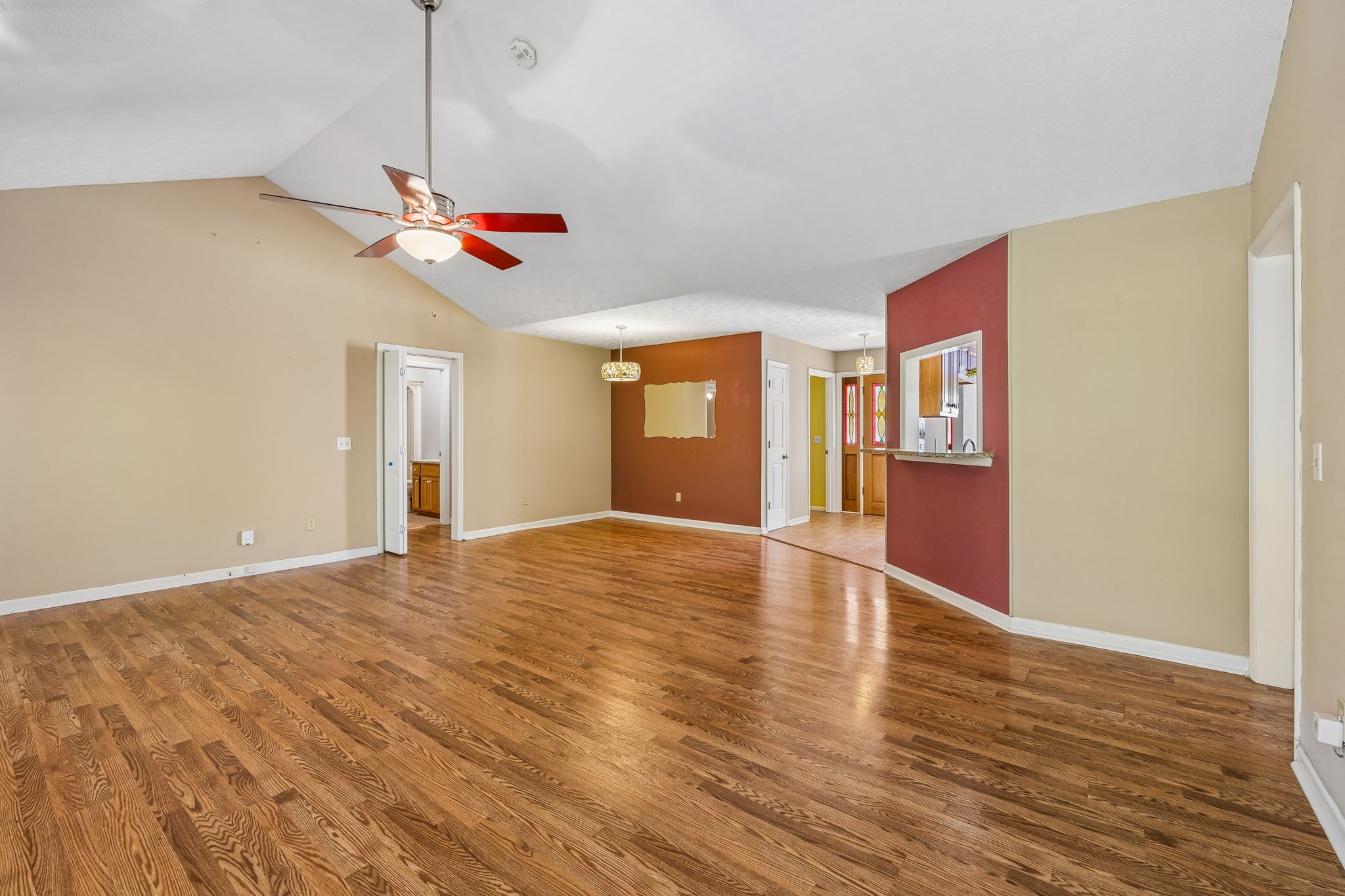 107 Keri Drive Pleasant View, TN 37146 - Photo 13 of 40 a view of an empty room with wooden floor and a ceiling fan