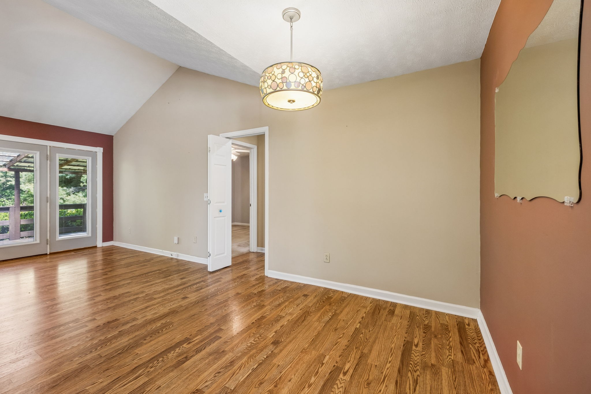 107 Keri Drive Pleasant View, TN 37146 - Photo 15 of 40 a view of an empty room with wooden floor and a window