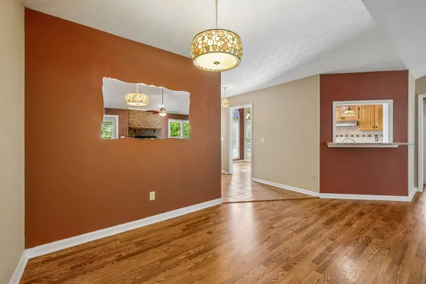 a view of a livingroom with wooden floor
