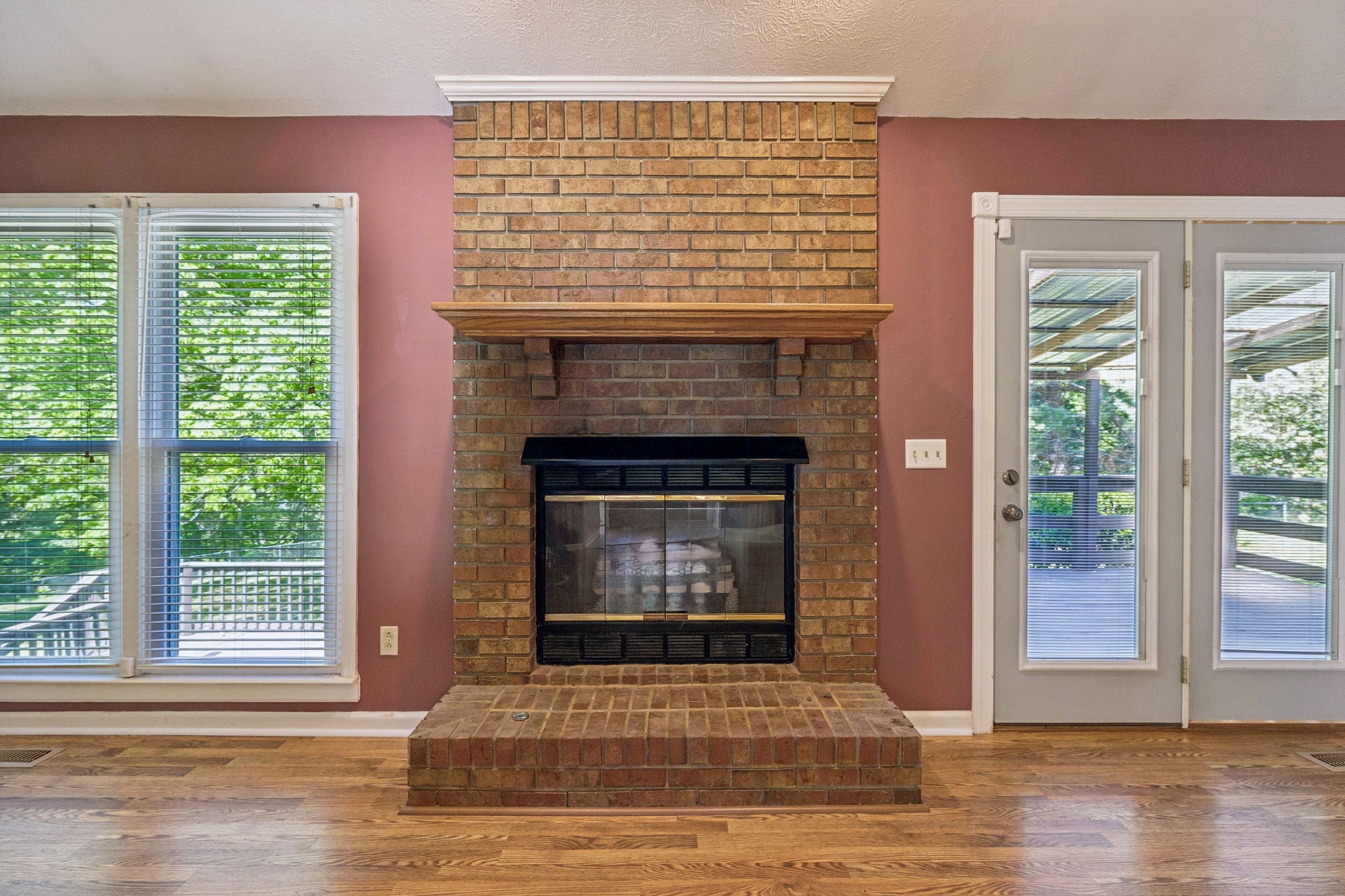 107 Keri Drive Pleasant View, TN 37146 - Photo 17 of 40 a living room with a fireplace and wooden floor