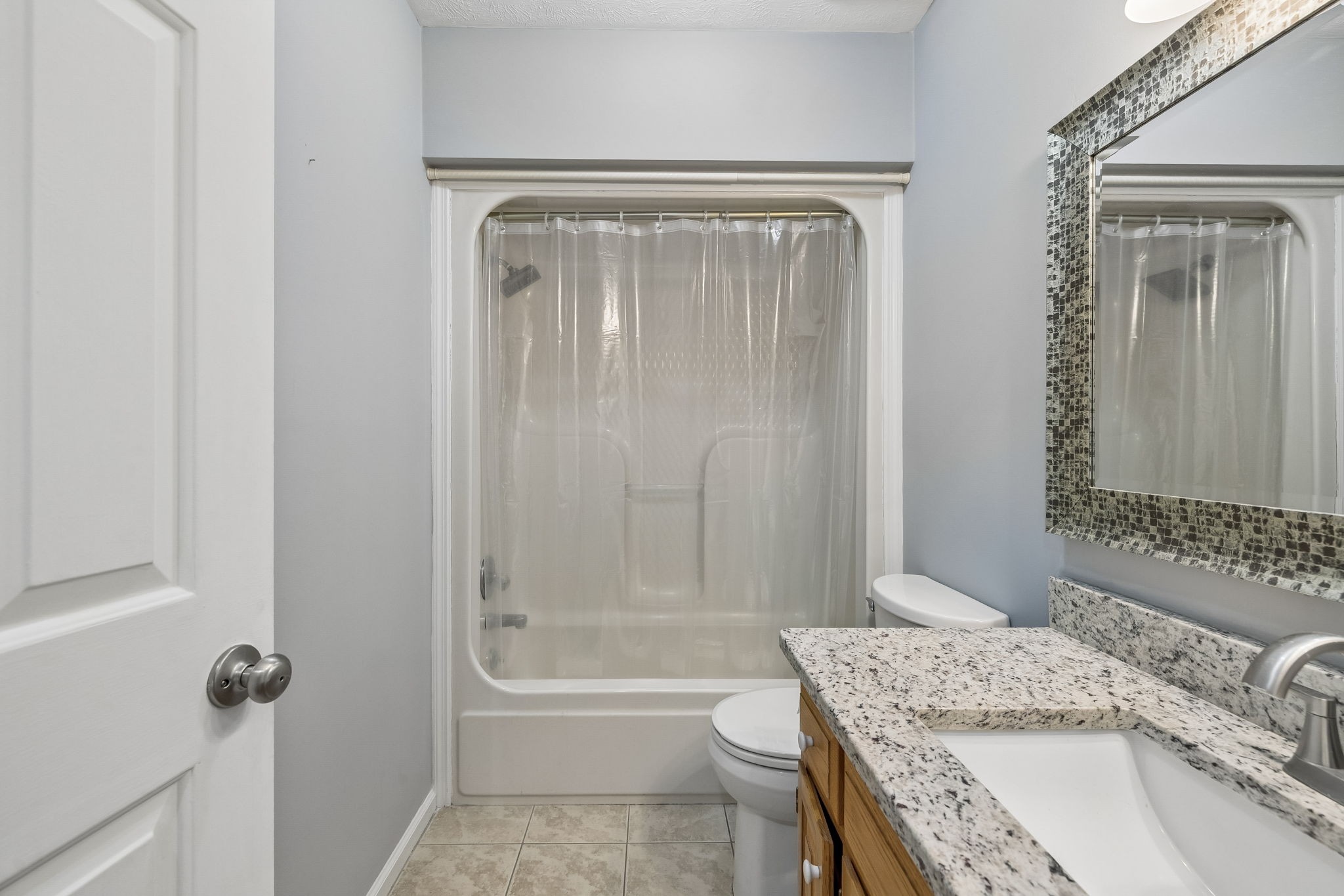 107 Keri Drive Pleasant View, TN 37146 - Photo 19 of 40 a bathroom with a granite countertop sink toilet and shower