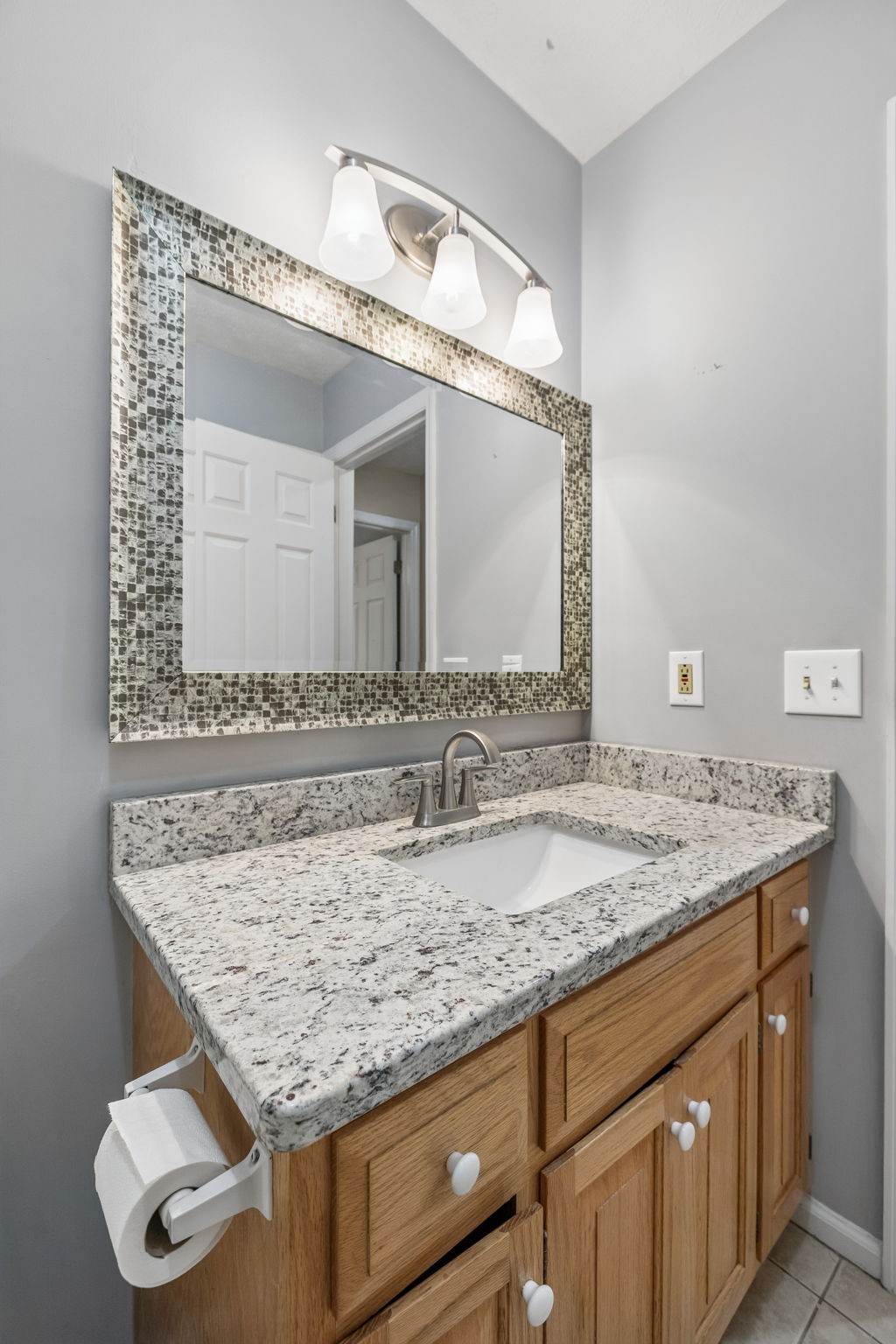 107 Keri Drive Pleasant View, TN 37146 - Photo 20 of 40 a bathroom with a granite countertop sink and a mirror