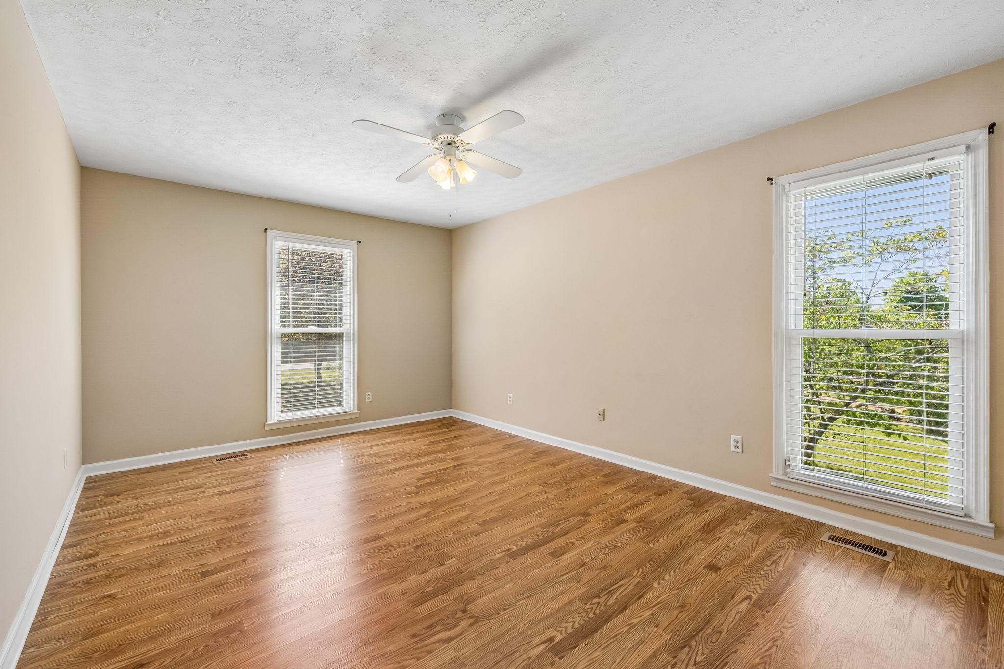 107 Keri Drive Pleasant View, TN 37146 - Photo 23 of 40 a view of an empty room with wooden floor and a window