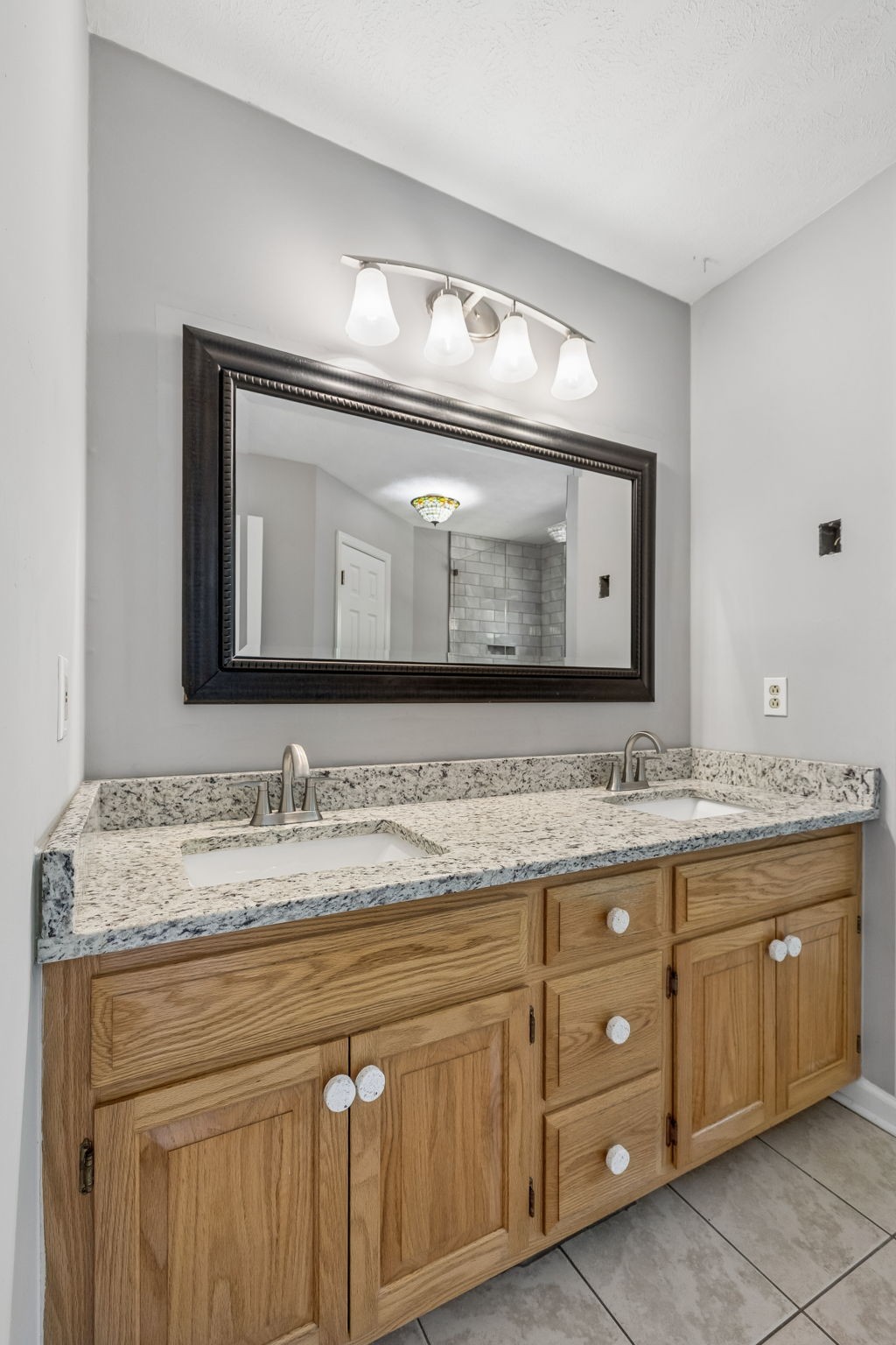 107 Keri Drive Pleasant View, TN 37146 - Photo 26 of 40 a bathroom with a double vanity sink and a mirror