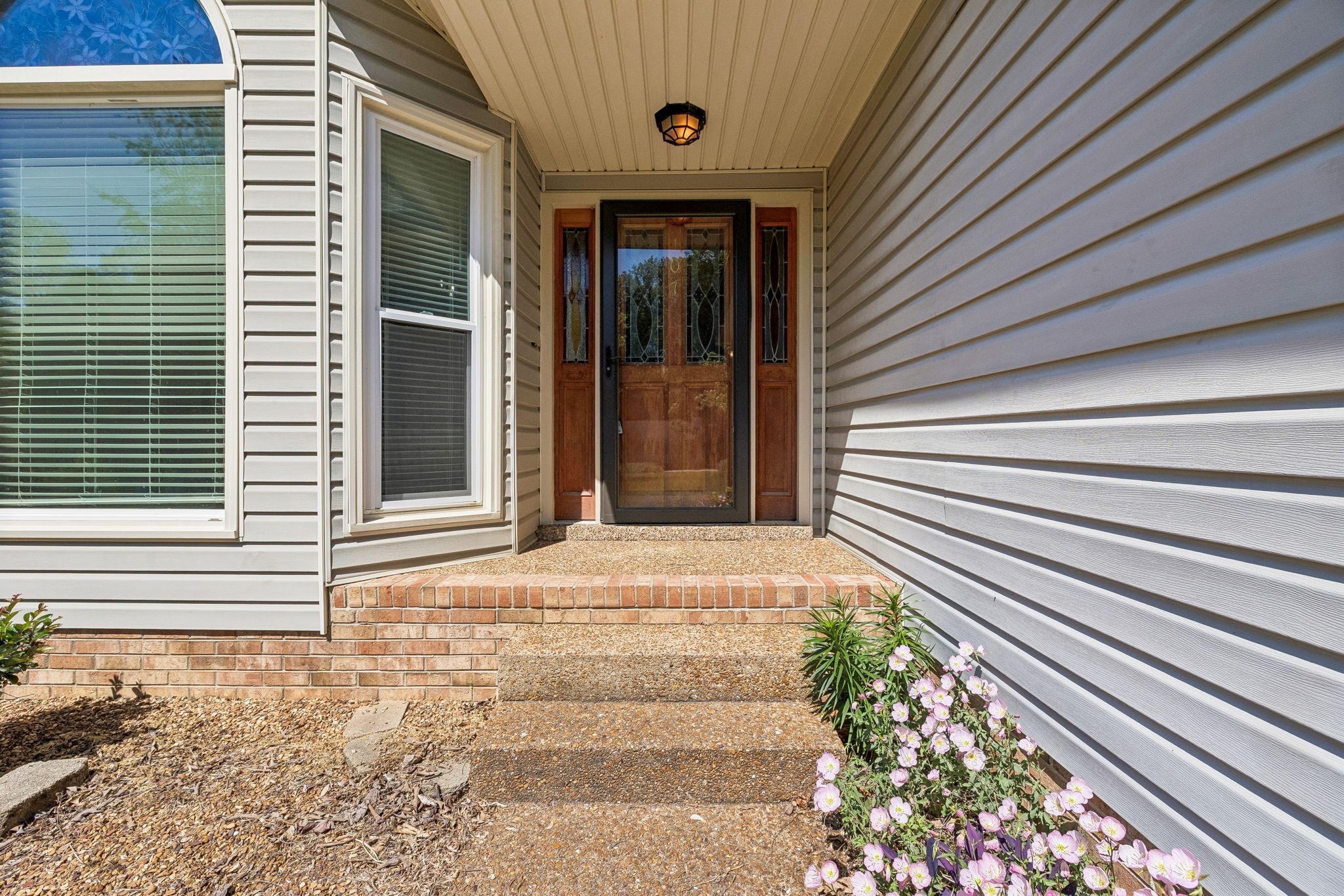 107 Keri Drive Pleasant View, TN 37146 - Photo 4 of 40 a front view of a house with a garden