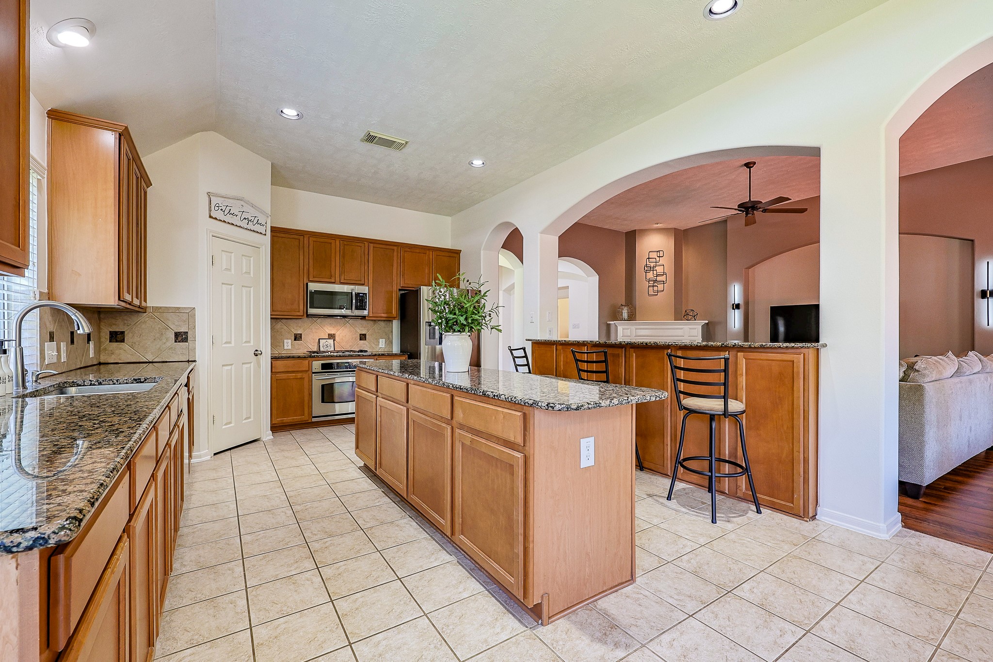 10306 Rudolph Court Missouri City, TX 77459 - Photo 10 of 34 Step into the heart of the home, where functionality meets timeless style. This spacious, open-concept kitchen is perfectly designed for both daily living and effortless entertaining.