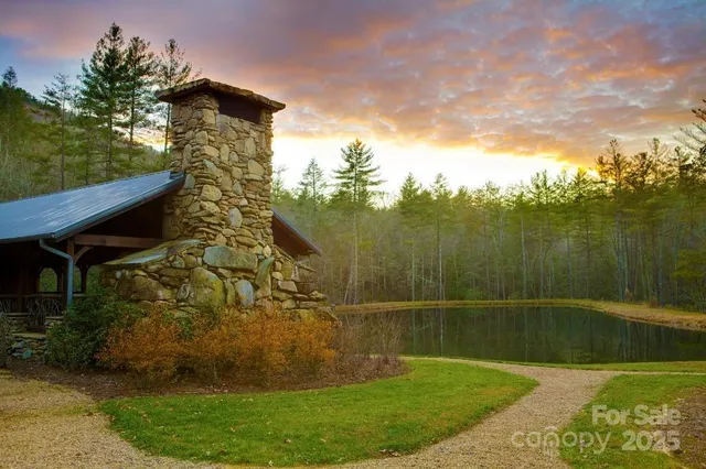 a aerial view of a house with a yard table and chairs