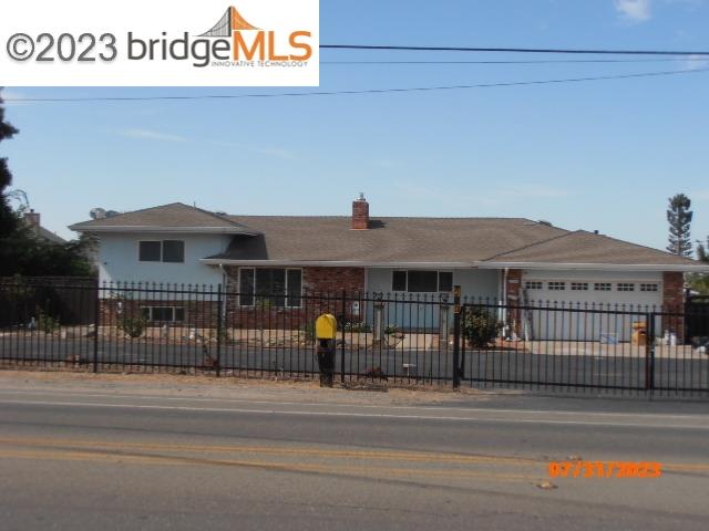 250 West Cypress Road Oakley, CA 94561 - Photo 1 of 1 a front view of a house with a iron gate