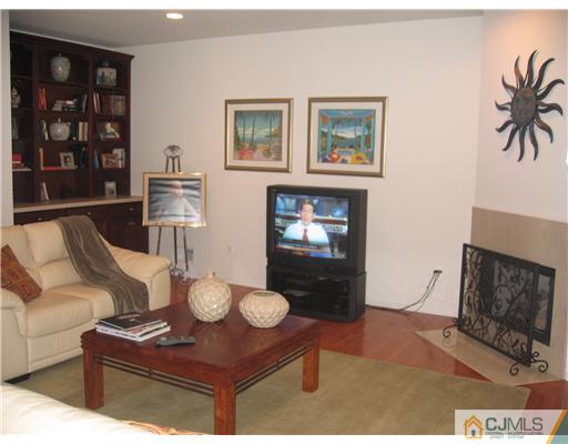 5 West Hill Road Colonia, NJ 07067 - Photo 3 of 7 a living room with furniture and a fireplace