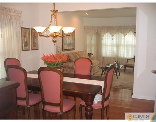 5 West Hill Road Colonia, NJ 07067 - Photo 4 of 7 a view of a dining room with furniture and wooden floor