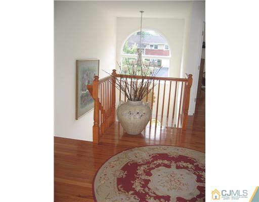 5 West Hill Road Colonia, NJ 07067 - Photo 5 of 7 a view of a hallway to a livingroom with furniture