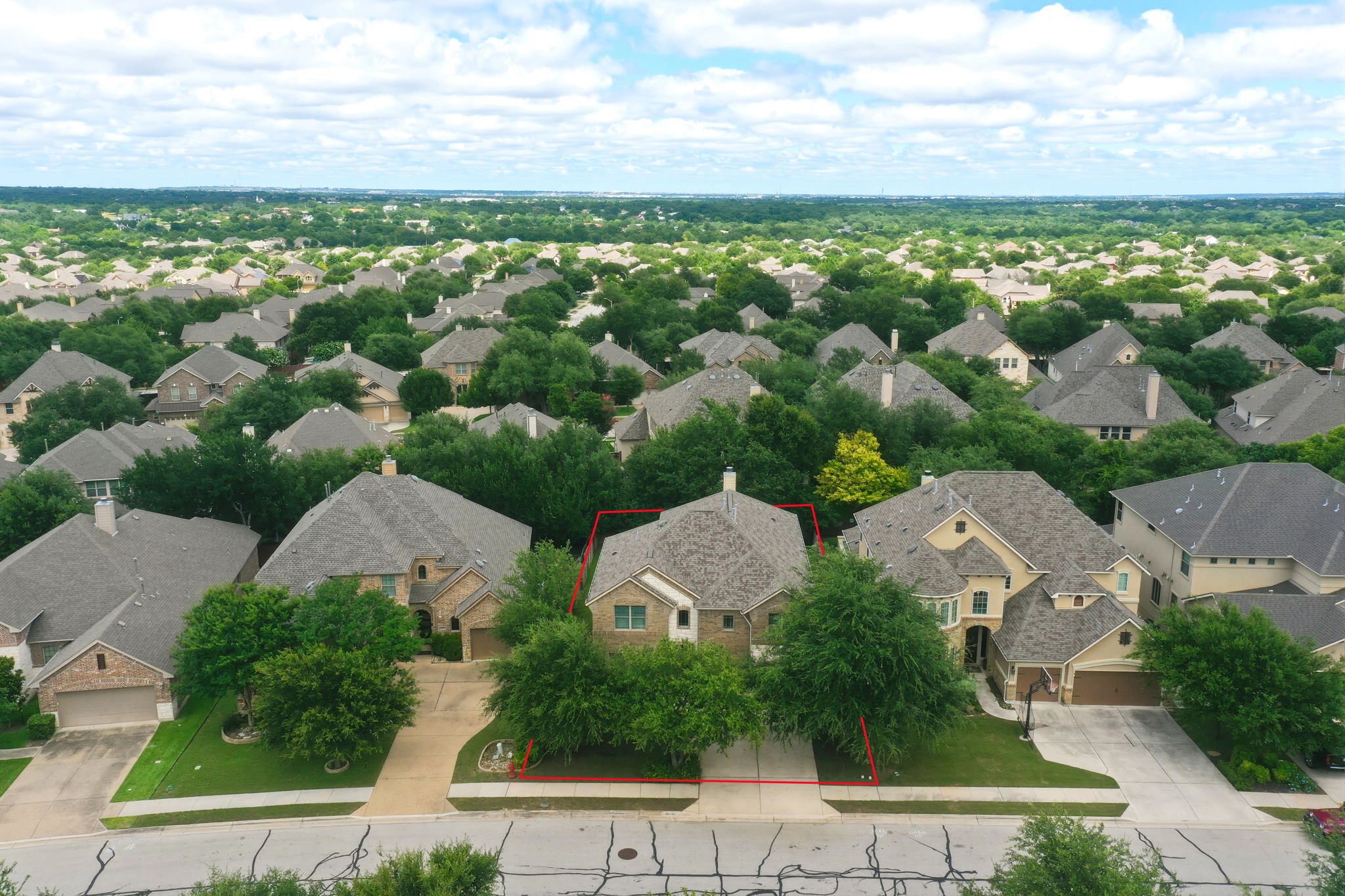 110 Dasher Drive Cedar Park, TX 78613 - Photo 4 of 39 An aerial panorama reveals an inviting suburban neighborhood nestled among a canopy of mature trees.