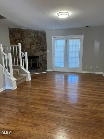 a view of a livingroom with wooden floor