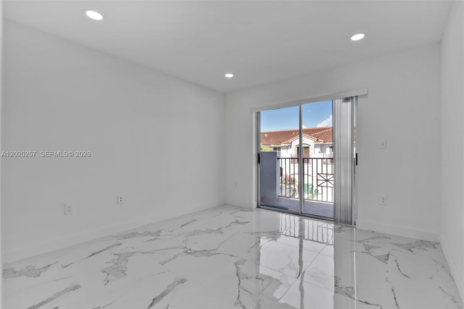 10245 Southwest 154th Place, Unit 1123 Miami, FL 33196 - Photo 25 of 38 a view of an empty room and window