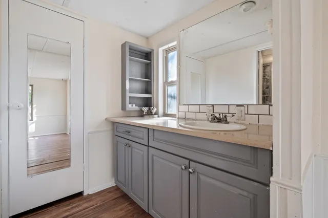 a bathroom with a sink and a mirror