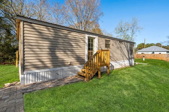 a view of a backyard with a small cabin
