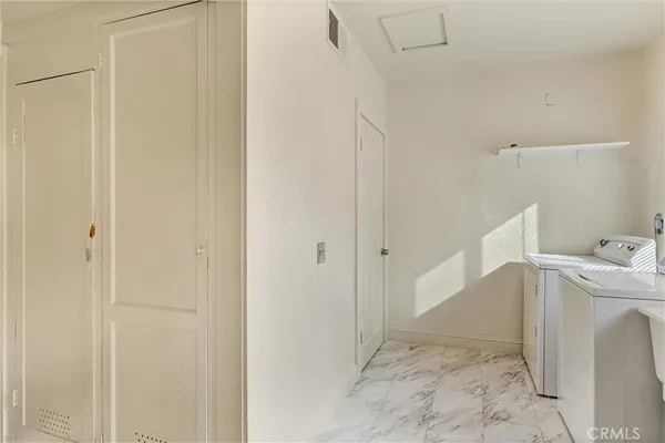a view of utility room with washer and dryer