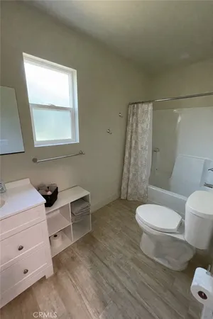 a bathroom with a toilet and a sink