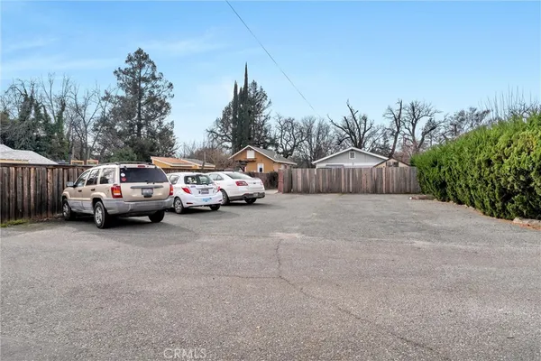 a view of street with parked cars