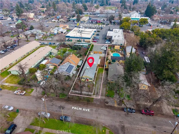 an aerial view of houses with yard