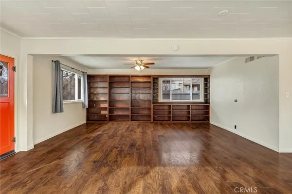 wooden floor and window in an empty room