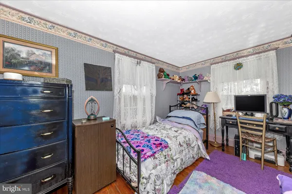 a bedroom with a bed and a tv in it