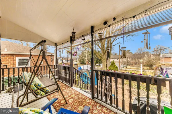 a view of house with backyard outdoor seating area