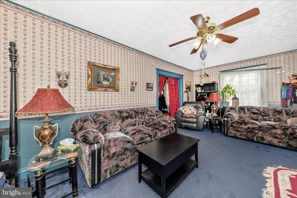 a bed room with furniture and a window